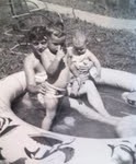 Mom with my brother and me in back yard pool!